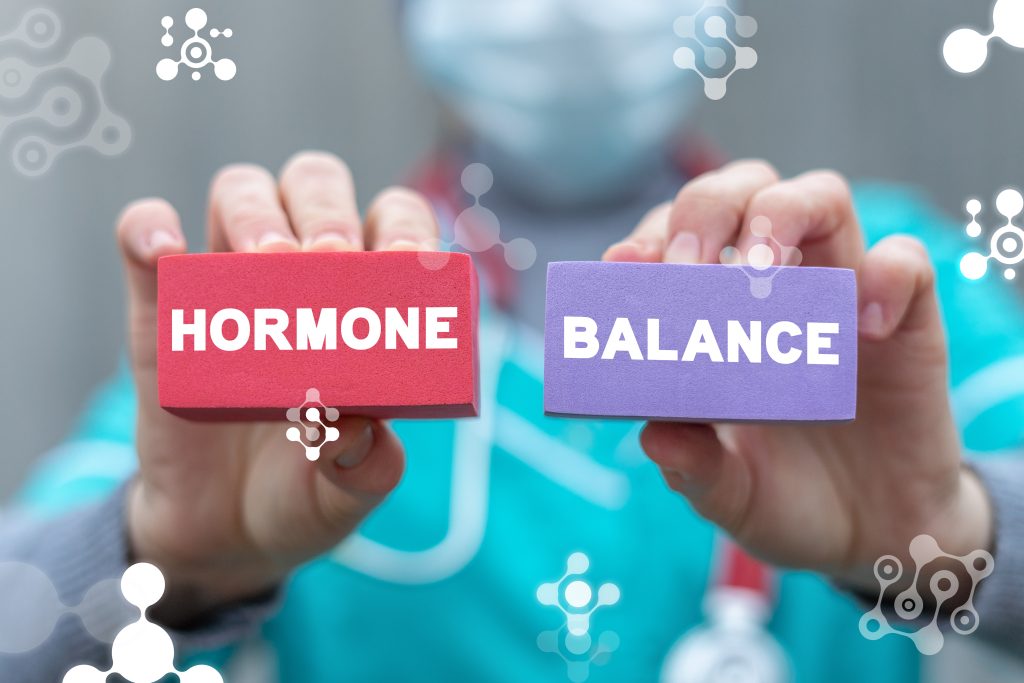 An illustration demonstrating the delicate balance of different hormones in the human body, symbolizing the importance of maintaining hormonal equilibrium for optimal health and well-being.